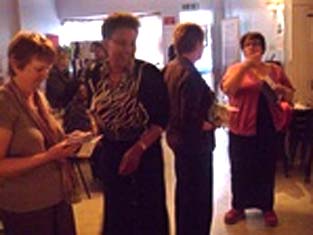Photograph of visitors sharing a joke
