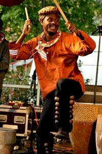 Photograph of Pedson Kasume drumming